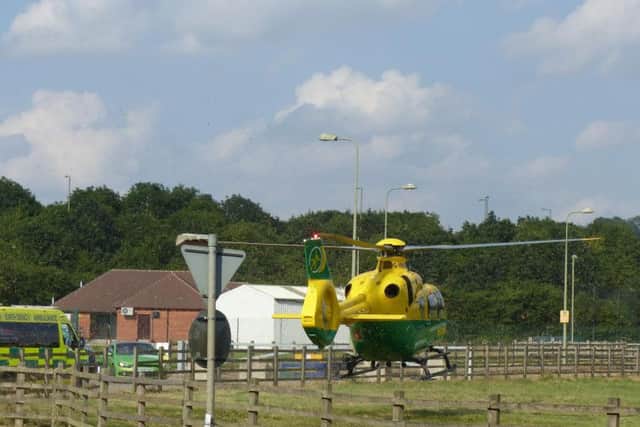The air ambulance landed on the field off Ermont Way to take the victim to hospital. Photo: Peter Spackman